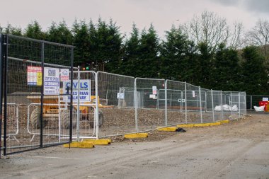 Temporary security fencing at the new McCarthy and Stone development  in Kendal, Cumbria, UK. McCarthy and Stone are known for building retirement apartments.