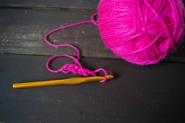 Pink Wool Ball Close Yellow Crochet Hook Wooden Ground Handmade — Stock Fotó