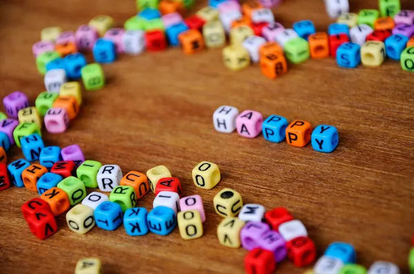 Word Happy Printed Small Plastic Cubes Surrounded Plastic Blocks Colorful — Stock Photo, Image