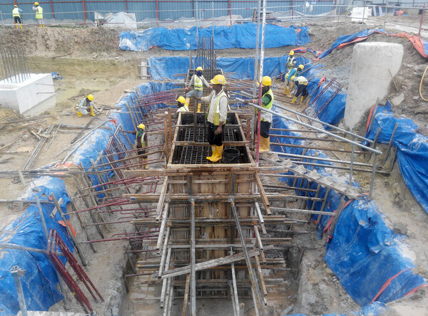 SELANGOR, MALAYSIA -SEPTEMBER 03, 2015: Pile cap formwork with reinforcement bar in it at the construction site in Selangor, Malaysia. Fabricated by workers 