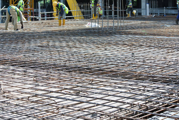 SELANGOR, MALAYSIA -MAY 13, 2016: Hot rolled deformed steel bars or steel reinforcement bars used at the construction site to strengthen concrete. It is shaped to follow the engineer's design.