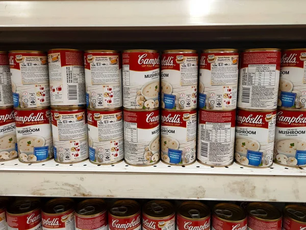 PENANG, MALAYSIA - JULY 13, 2021: Selected focused on mushroom soup in various flavors packed in the commercial packaging. Displayed for customers on the sales shelf. Tagged with the price tag. 