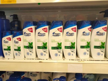 PENANG, MALAYSIA -JUNE 10, 2021: Selected focused on the hair shampoo in plastic bottle packaging, on display for sale on the shelves in the supermarket. Tagged with the price tag.