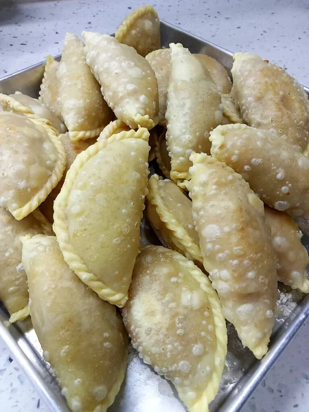 Malaysian curry puffs. Also known as karipap. It is one of the traditional food in Malaysia. Skin made from the wheat flour mixture and the inside is potato and curry mixture.