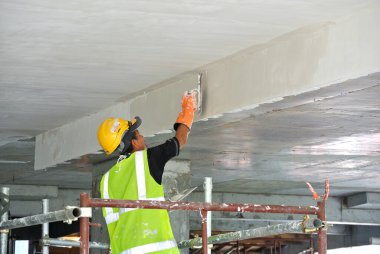 Selangor, Malezya-03 Eylül 2016: Site çalışanları recessed yağsız kat işini inşaat sahasında yapıyorsunuz. 