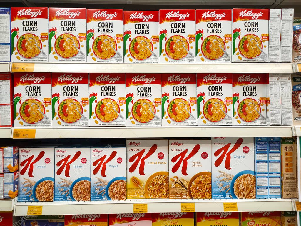 SELANGOR, MALAYSIA - MARCH 5, 2022: SELANGOR, MALAYSIA - MARCH 5, 2022: Kellogg's corn flakes in commercial packaging are made from paper boxes. On display for sale in-store.