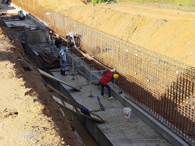 SELANGOR, MALAYSIA - JULY 22, 2021: Retaining wall is under construction. The retaining wall was built according to the engineer's design. The site is excavated to build the foundation structure