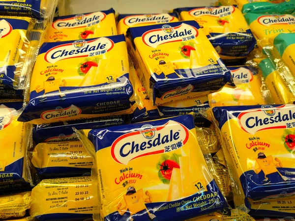 SELANGOR, MALAYSIA -12 APRIL 2022: Sliced cheese placed in commercial packs and displayed for sale. Each pack has several slices of cheese. Separated by brand, type and flavor.