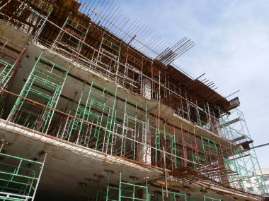 SELANGOR, MALAYSIA -JULY 4, 2021: Scaffolding is installed as temporary support for concrete formwork at the construction site. Installed according to the design approved by the engineer.