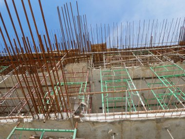 SELANGOR, MALAYSIA -JULY 4, 2021: Scaffolding is installed as temporary support for concrete formwork at the construction site. Installed according to the design approved by the engineer.
