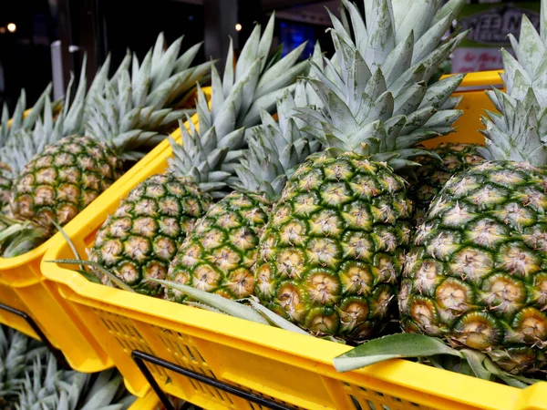 Pineapples that have been picked are displayed for sale. Pineapples are tropical fruits. Pineapple is suitable to be eaten as it is or used as a cooking ingredient.