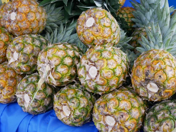 Pineapples that have been picked are displayed for sale. Pineapples are tropical fruits. Pineapple is suitable to be eaten as it is or used as a cooking ingredient.