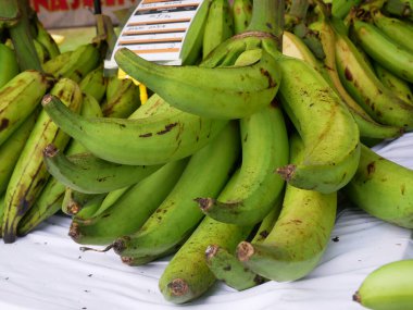 SELANGOR, MALAYSIA - AUGUST 5, 2022: Ripe bananas displayed for sale. Some can be eaten straight away and some need to wait a few days. Is a nutritious tropical fruit.