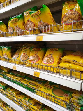 SELANGOR, MALAYSIA -AUGUST 5, 2022: Pasta and macaroni in commercial packs and displayed for sale on shelves. Separated by brand and type. Clearly labeled and has a price tag.