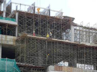 SELANGOR, MALAYSIA -JULY 4, 2021: Scaffolding is installed as temporary support for concrete formwork at the construction site. Installed according to the design approved by the engineer.