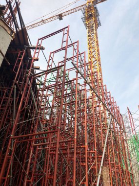 SELANGOR, MALAYSIA -JULY 4, 2021: Scaffolding is installed as temporary support for concrete formwork at the construction site. Installed according to the design approved by the engineer.