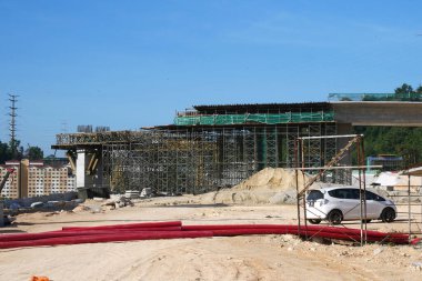 SELANGOR, MALAYSIA -JULY 4, 2021: Scaffolding is installed as temporary support for concrete formwork at the construction site. Installed according to the design approved by the engineer.