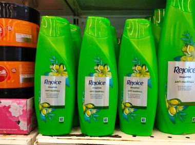 SELANGOR, MALAYSIA -JUNE 6, 2022: Selected focused on the hair shampoo in plastic bottle packaging, on display for sale on the shelves in the supermarket. Tagged with the price tag.