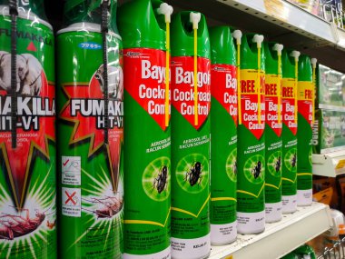SEREMBAN, MALAYSIA -JUNE 6, 2022: Various brands of aerosol-type insecticides in commercial cans. Displayed for sale. Labeled with a price tag.