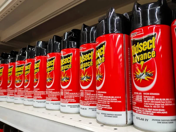 SEREMBAN, MALAYSIA -JUNE 6, 2022: Various brands of aerosol-type insecticides in commercial cans. Displayed for sale. Labeled with a price tag.
