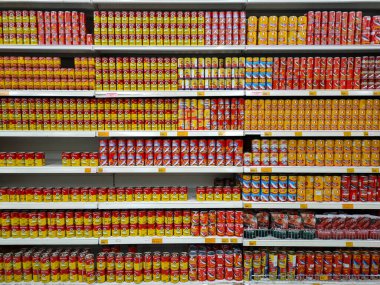 SELANGOR, MALAYSIA -JULY 6, 2022: Selective focused on sardine fish can. The fish has been processed, cook and packed in the can. Displayed on the rack for sale and tag with the price tag