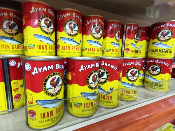 SELANGOR, MALAYSIA -JULY 6, 2022: Selective focused on sardine fish can. The fish has been processed, cook and packed in the can. Displayed on the rack for sale and tag with the price tag