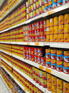 SELANGOR, MALAYSIA -JULY 6, 2022: Selective focused on sardine fish can. The fish has been processed, cook and packed in the can. Displayed on the rack for sale and tag with the price tag