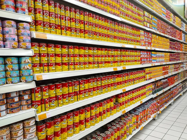 SELANGOR, MALAYSIA -JULY 6, 2022: Selective focused on sardine fish can. The fish has been processed, cook and packed in the can. Displayed on the rack for sale and tag with the price tag