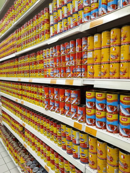 SELANGOR, MALAYSIA -JULY 6, 2022: Selective focused on sardine fish can. The fish has been processed, cook and packed in the can. Displayed on the rack for sale and tag with the price tag