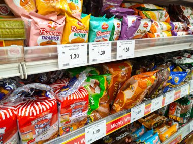 SEREMBAN, MALAYSIA -APRIL 28, 2020: Various types of bread in commercial packaging displayed on shelves for sale. Separated by type and brand to make it easier for customers to choose.