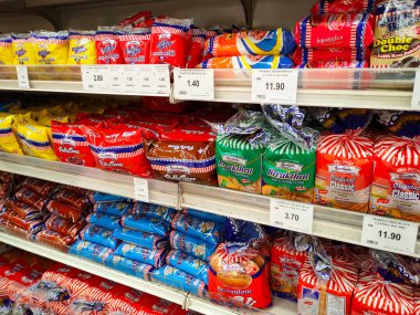 SEREMBAN, MALAYSIA -APRIL 28, 2020: Various types of bread in commercial packaging displayed on shelves for sale. Separated by type and brand to make it easier for customers to choose.