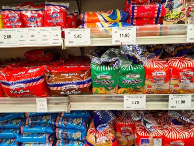 SEREMBAN, MALAYSIA -APRIL 28, 2020: Various types of bread in commercial packaging displayed on shelves for sale. Separated by type and brand to make it easier for customers to choose.