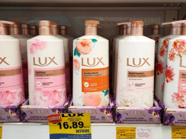 MELAKA, MALAYSIA -JUNE 6, 2022: Liquid bath soap in plastic bottles and commercial soft packets. Sorted by type and brand. Price tags are placed to make it easier for buyers.