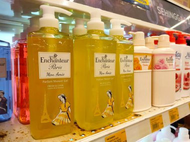 MELAKA, MALAYSIA -JUNE 6, 2022: Liquid bath soap in plastic bottles and commercial soft packets. Sorted by type and brand. Price tags are placed to make it easier for buyers.