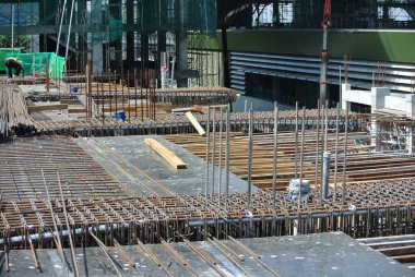 MALACCA, MALAYSIA -JULY 16, 2016: Hot rolled deformed steel bars or steel reinforcement bar at construction site. It is use to strengthen concrete known as reinforcement concrete. 