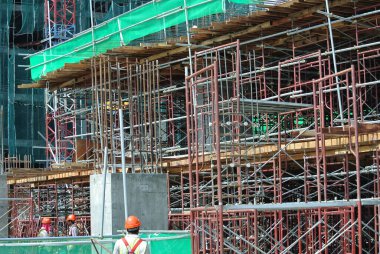 JOHOR, MALAYSIA -JULY 29, 2016: Scaffolding used as the temporary structure to support platform, form work and structure at the construction site. Also used it as a walking platform for workers. 