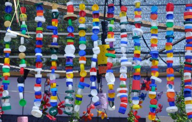 Bottle caps made of plastic combined and hanged.