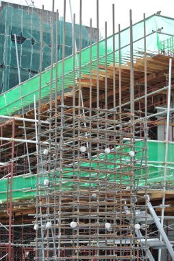 KEDAH, MALAYSIA -AUGUST 05, 2016: Layer of net used to cover the external wall scaffolding. It function is to prevent unwanted object falling outside from the construction site. 