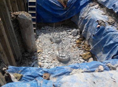 JOHOR, MALAYSIA -MARCH 28, 2016: Excavated and cut to level bore pile at the construction site. Ready to construct pile cap reinforcement bar as next step of work. 