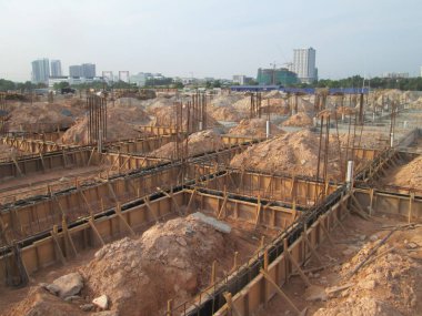 JOHOR, MALAYSIA -APRIL 06, 2016: Ground beam timber form work constructed by workers at the construction site. 