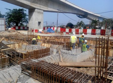 JOHOR, MALAYSIA -APRIL 06, 2016: Ground beam timber form work constructed by workers at the construction site. 