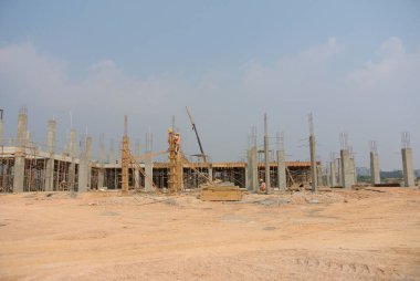 MALACCA, MALAYSIA -JUNE 13, 2016: Construction site in progress at Malacca, Malaysia during daytime. Workers busy with their task such as installing form work and reinforcement bar.     