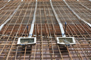 PERAK, MALAYSIA -APRIL 12, 2016: Floor slab reinforcement bar with post tension cable tendon on timber form work at the construction site in Perak, Malaysia