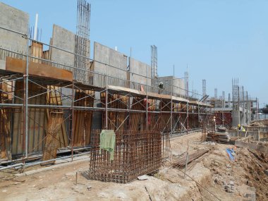 MALACCA, MALAYSIA -MAY 30, 2016: Construction site in progress at MALACCA, Malaysia during daytime. Workers busy with their task such as installing timber form work and reinforcement bar.     