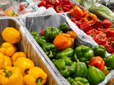 MELAKA, MALAYSIA - JULY 4, 2022: Fresh fruits and vegetables in a supermarket. Some are wrapped in plastic to maintain freshness. Has a price tag and is displayed for sale.