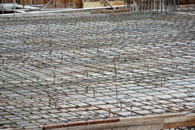 SELANGOR, MALAYSIA -MAY 18, 2016: Hot rolled deformed steel bars or steel reinforcement bar tied together before cast in the concrete. Its function is to increase the concrete strength. 