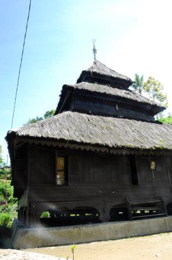 SUMATERA, INDONESIA -JUNE 8, 2014: Architectural detail and wood craft at Tuo Kayu Jao Mosque in West Sumatra, Indonesia. Built in 1599 and is the second oldest mosque in Indonesia.