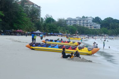 PORT DICKSON, MALAYSIA -MAY 08, 2016: Banana boat for rent at Port Dickson Beach in Malaysia. Port Dickson is one of the famous tourist spot in Malaysia.   