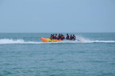 PORT DICKSON, MALAYSIA -MAY 08, 2016: Banana boat for rent at Port Dickson Beach in Malaysia. Port Dickson is one of the famous tourist spot in Malaysia.   
