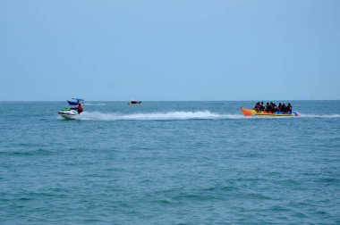 PORT DICKSON, MALAYSIA -MAY 08, 2016: Banana boat for rent at Port Dickson Beach in Malaysia. Port Dickson is one of the famous tourist spot in Malaysia.   